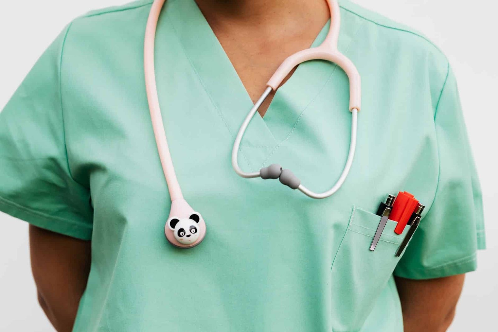a doctor in a scrub suit with a stethoscope